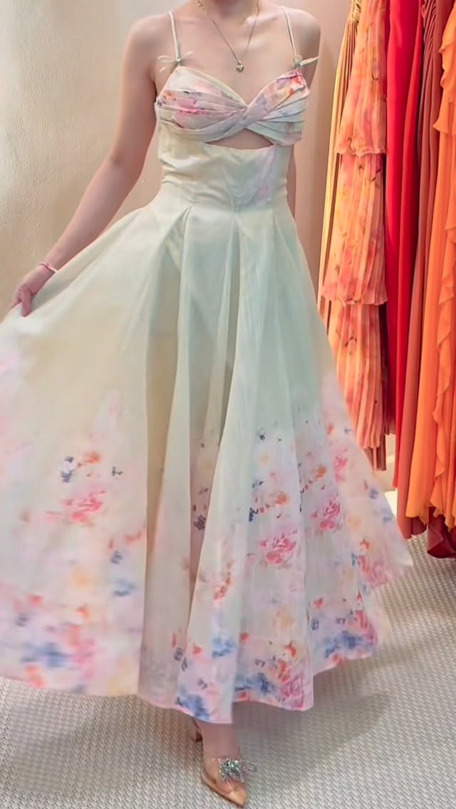 Floral watercolour midi gown in mint, displayed in showroom